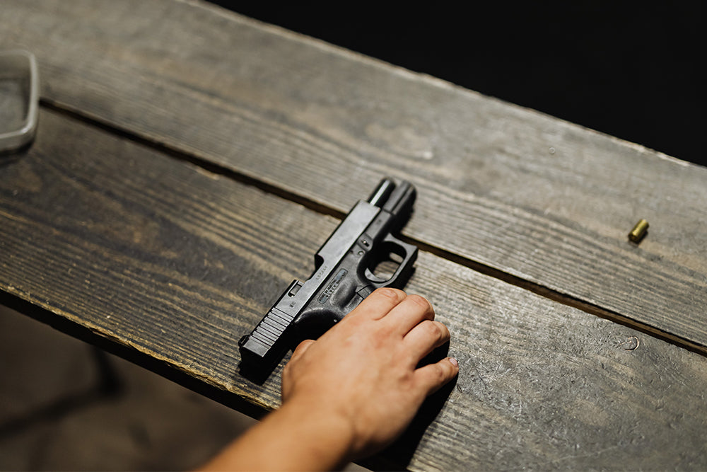 Black handgun on table